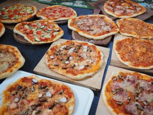 A table full of pizza.